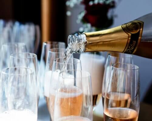 Champagne being poured into glasses in celebration