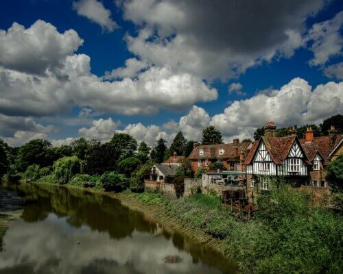 picture of hertfordshire town buildings along a river on a sunny day